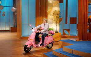 Ellen riding a Vespa